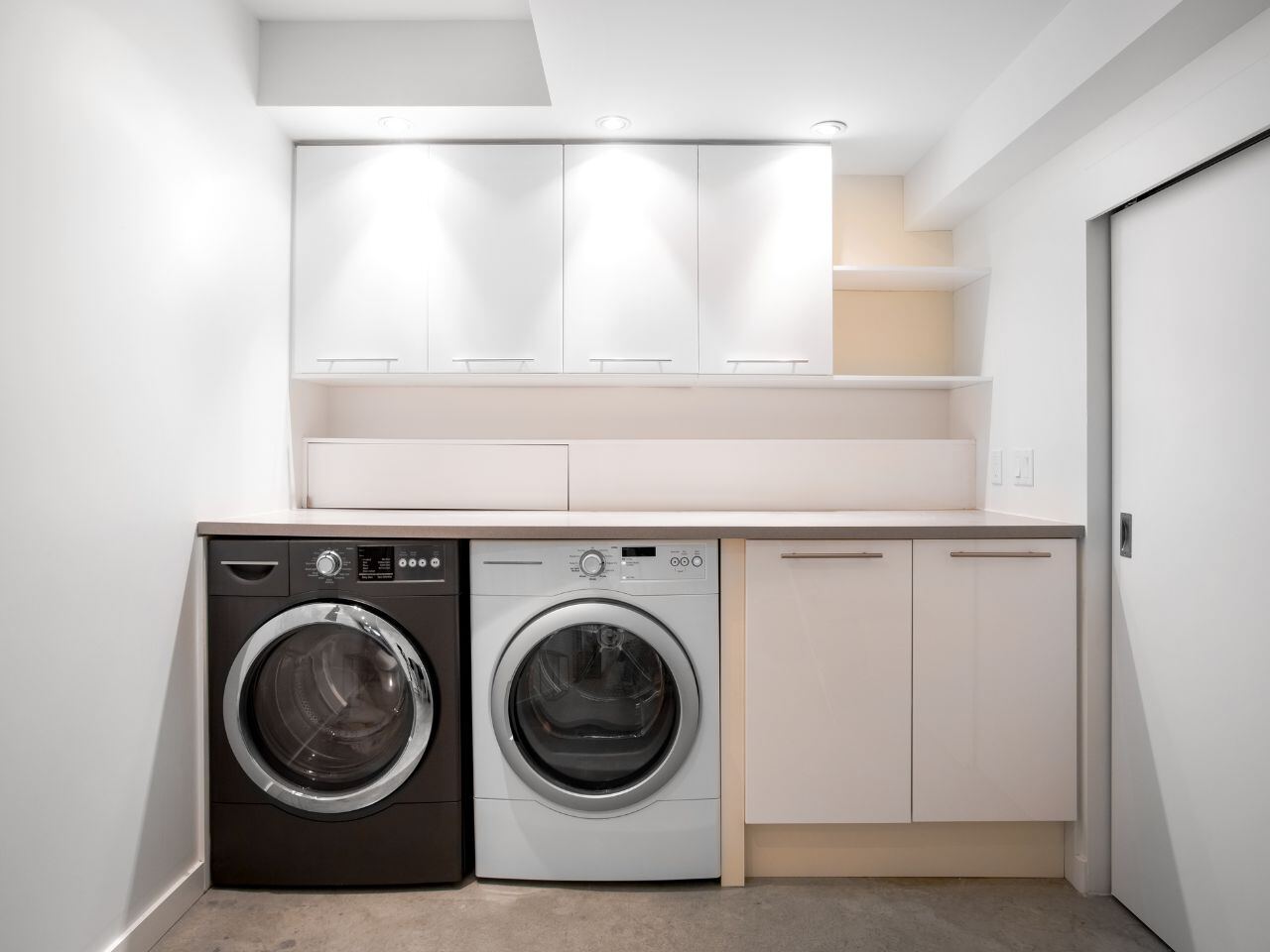 Washer and dryer laundry room inside a JC Housing student rental